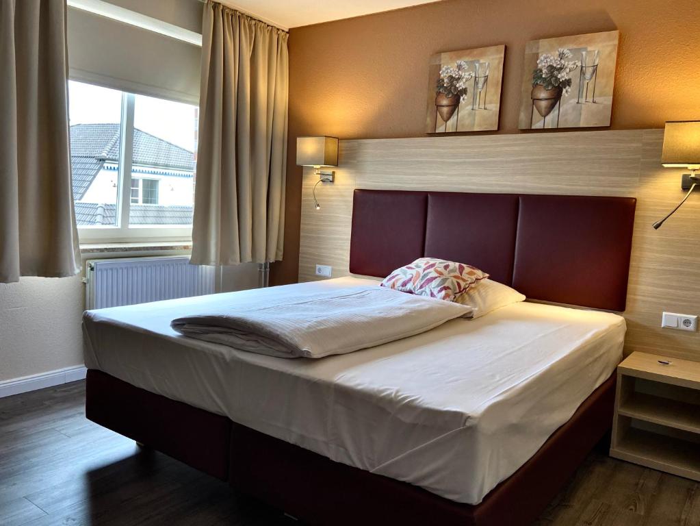 Postel nebo postele na pokoji v ubytování Residenz Hotel Neu Wulmstorf