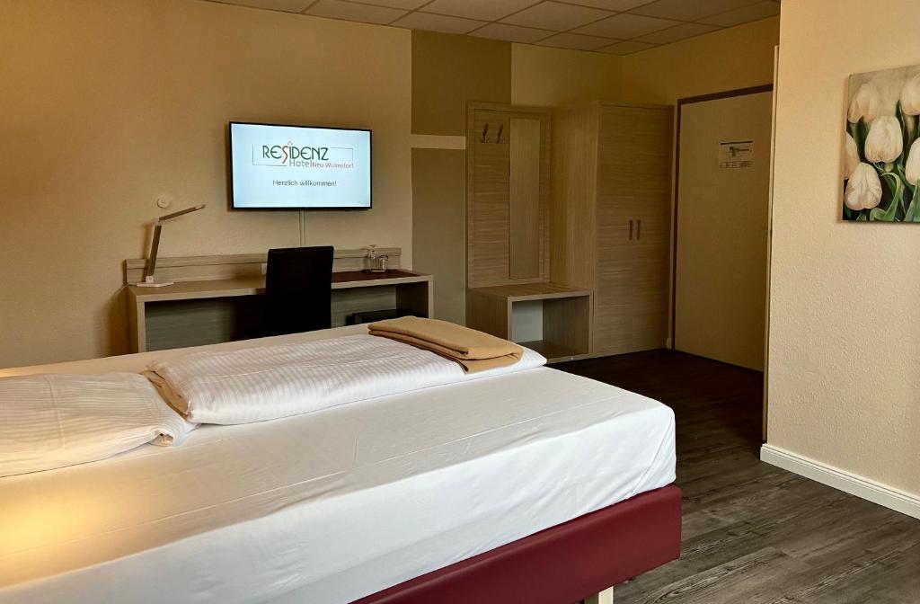 Postel nebo postele na pokoji v ubytování Residenz Hotel Neu Wulmstorf