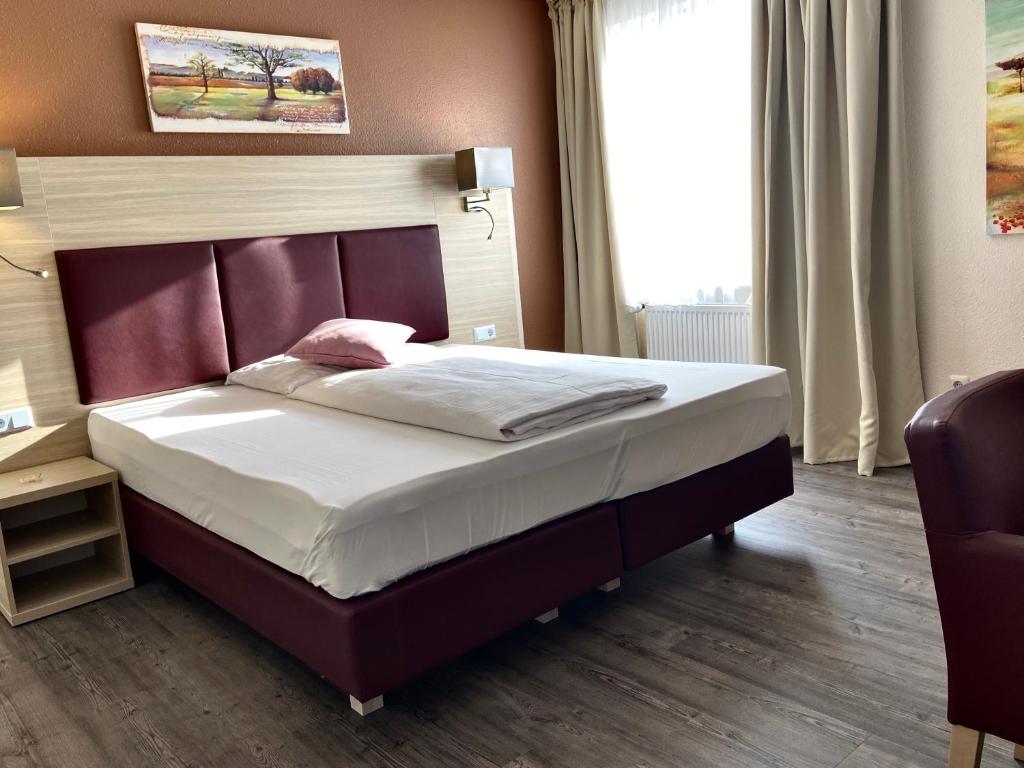 Postel nebo postele na pokoji v ubytování Residenz Hotel Neu Wulmstorf