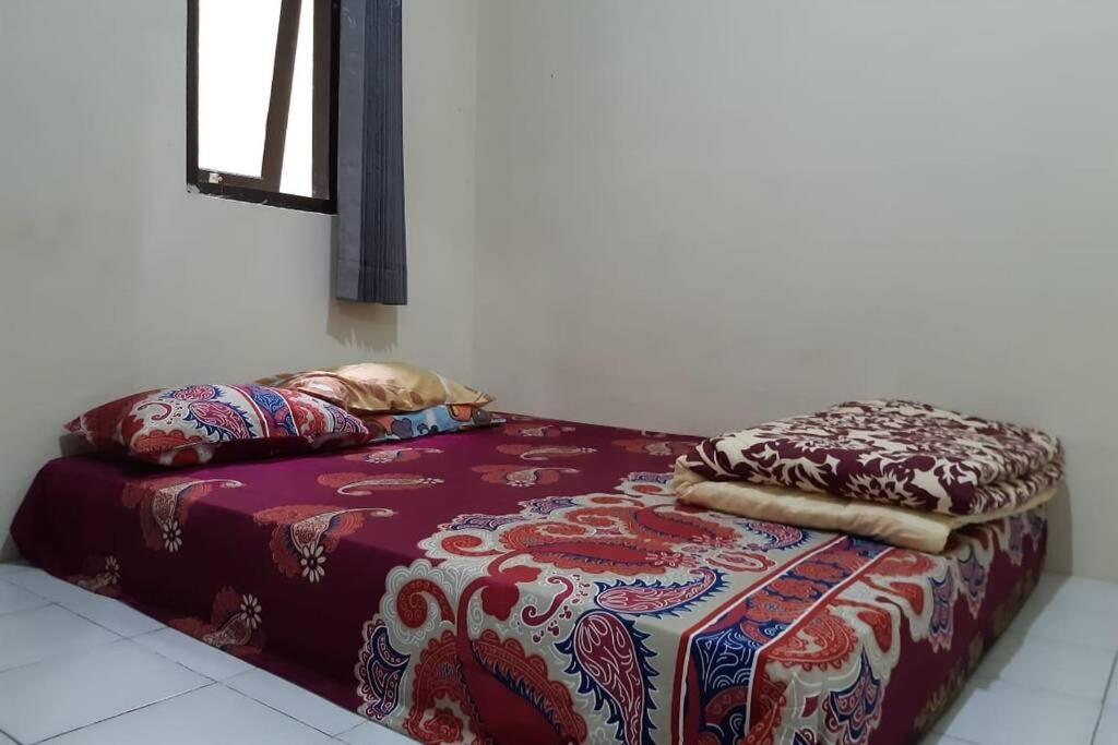 Postel nebo postele na pokoji v ubytování Anindya House