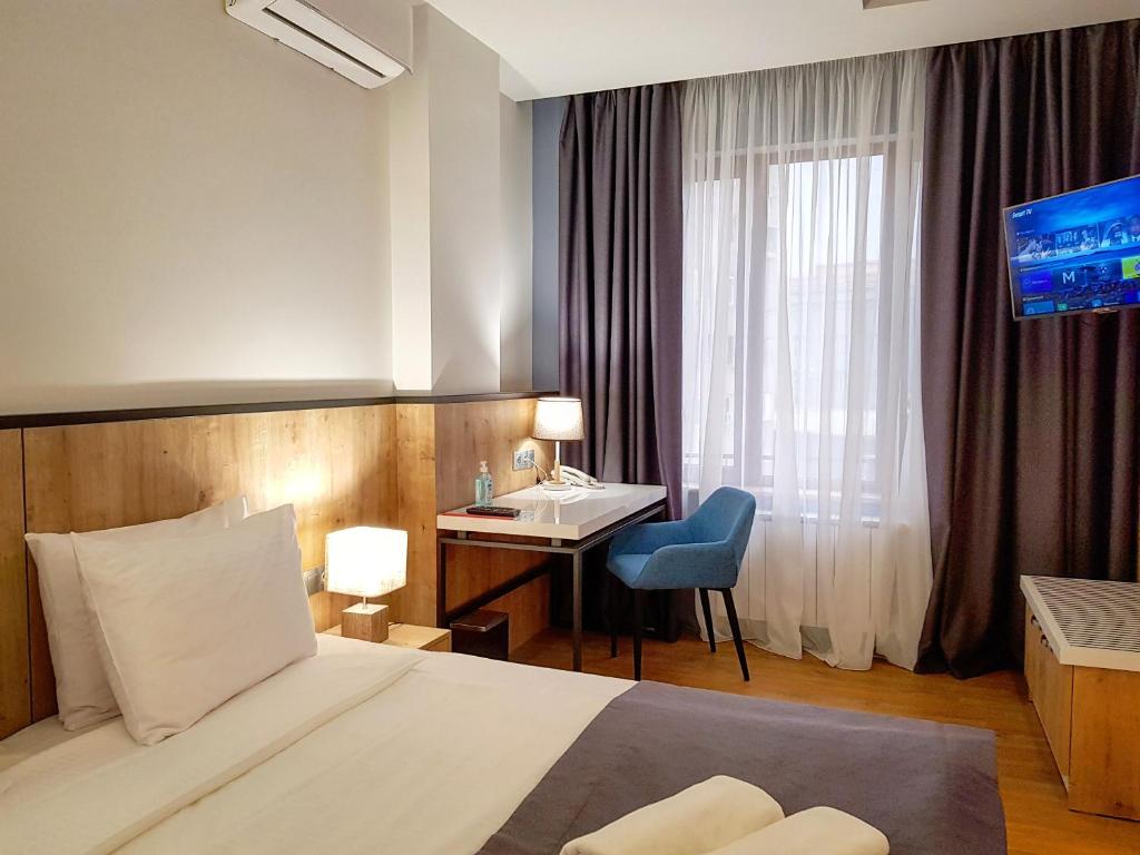 Postel nebo postele na pokoji v ubytování Hotel Alpha