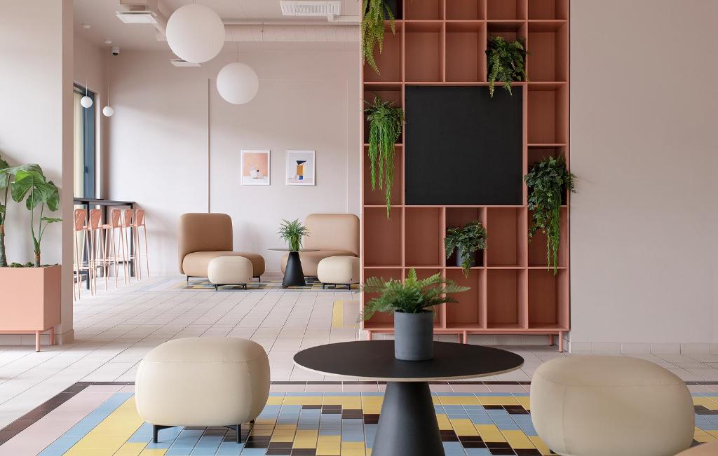 TV a/nebo společenská místnost v ubytování Hugo Apartment Hotel