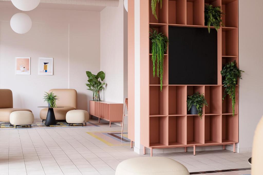 TV a/nebo společenská místnost v ubytování Hugo Apartment Hotel