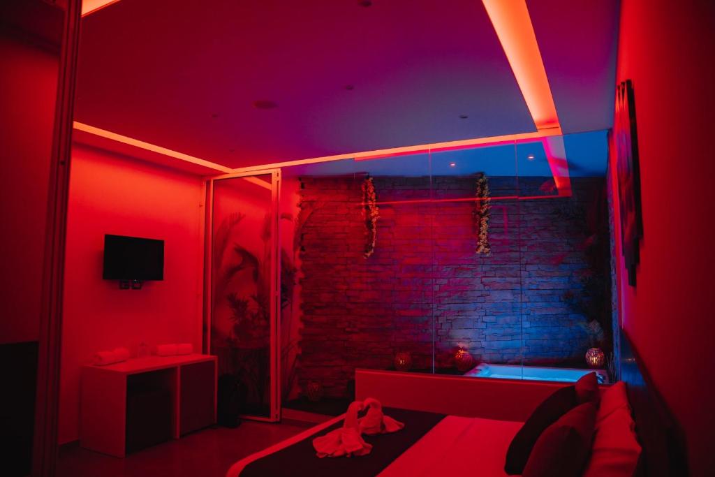 a red room with a shower with a brick wall at La collina di Capodimonte in Naples