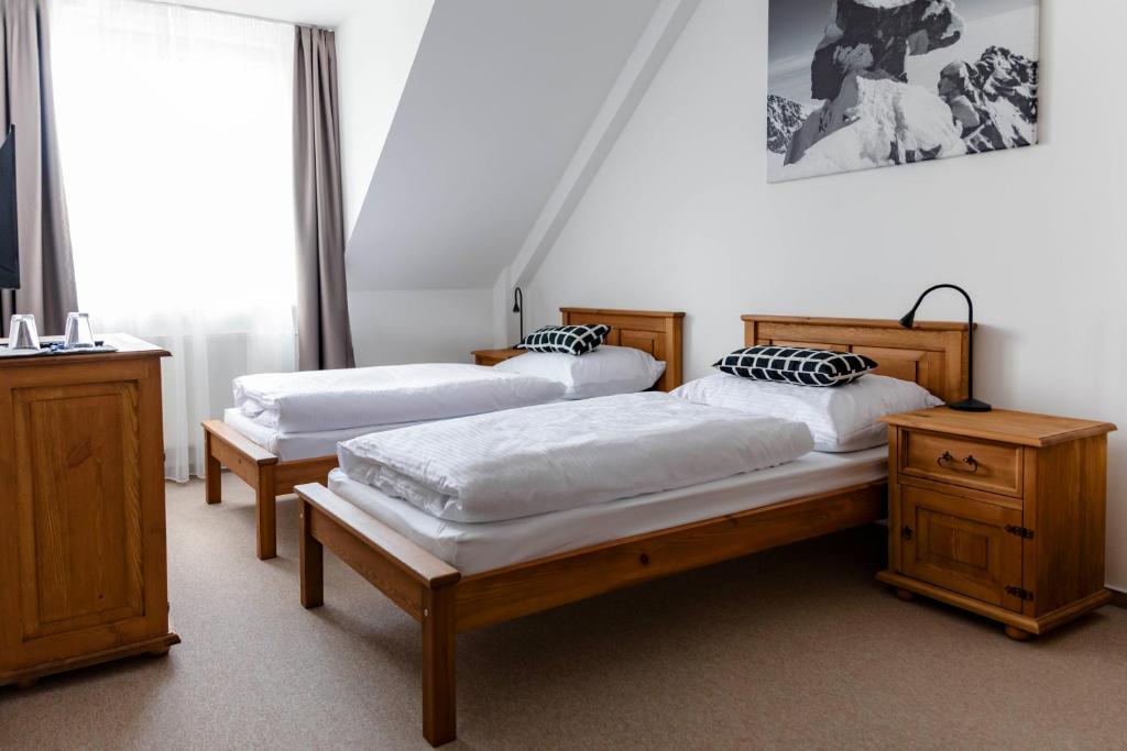 A bed or beds in a room at Chalet Nova Lesna Mountain View