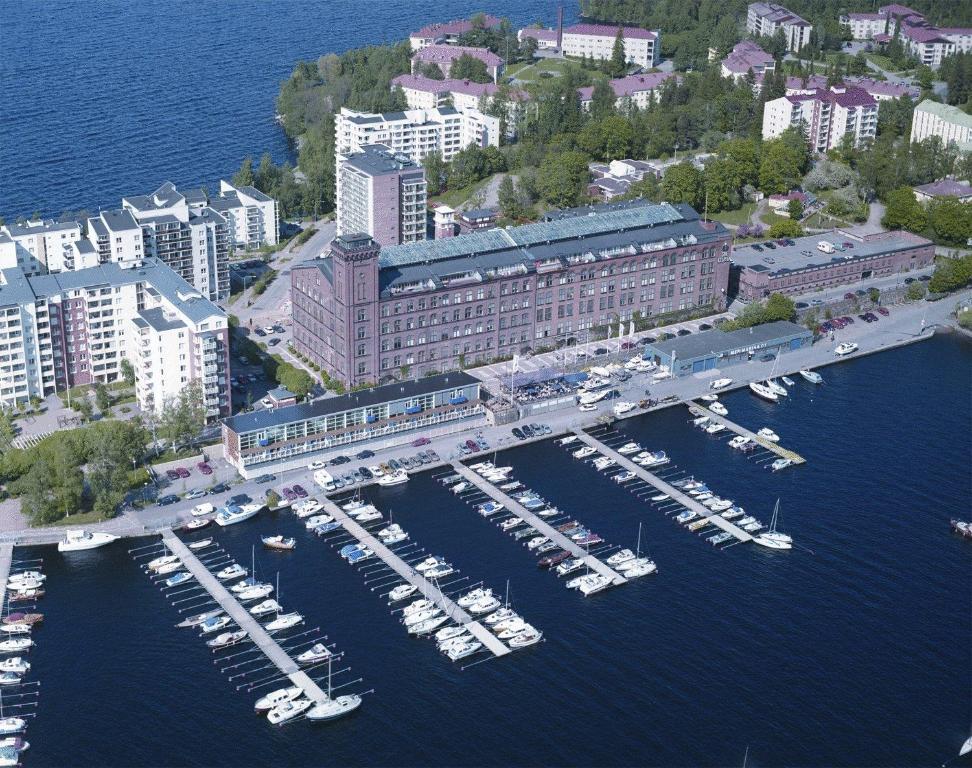 an aerial view of a marina with boats in the water at Holiday Club Tampereen Kehräämö Apartments in Tampere