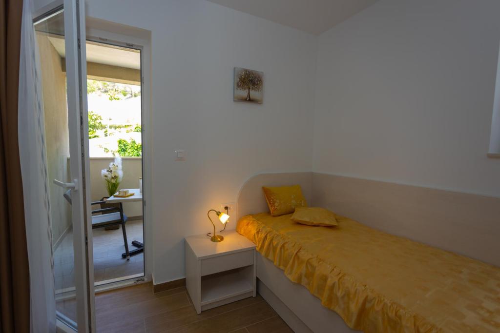 Postel nebo postele na pokoji v ubytování Apartments Vicin