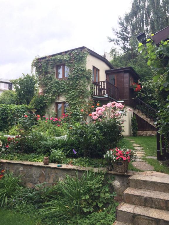 a house with flowers in front of it at Wild Wine House in Gdynia