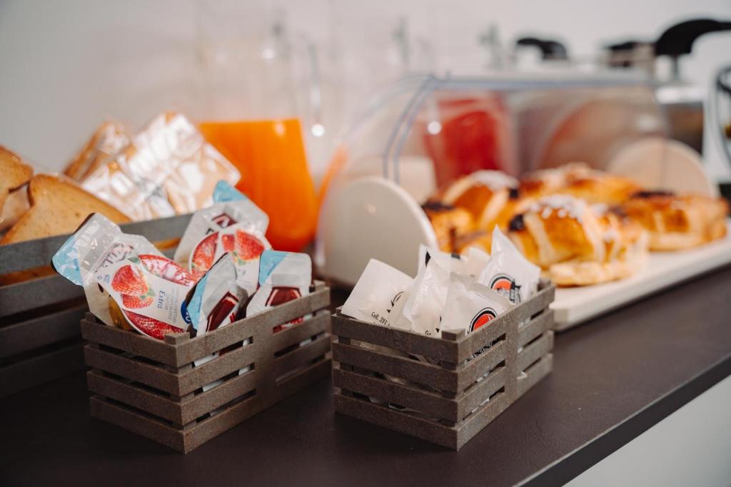 two baskets of pastries and bread on a counter at La collina di Capodimonte in Naples