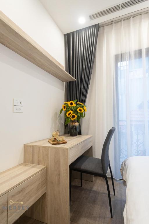 Postel nebo postele na pokoji v ubytování Mersey Central Hanoi Apart'Hotel