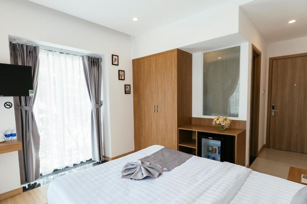 Postel nebo postele na pokoji v ubytování Minh Chi Hotel