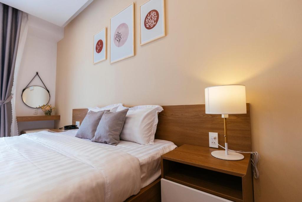 Postel nebo postele na pokoji v ubytování Minh Chi Hotel