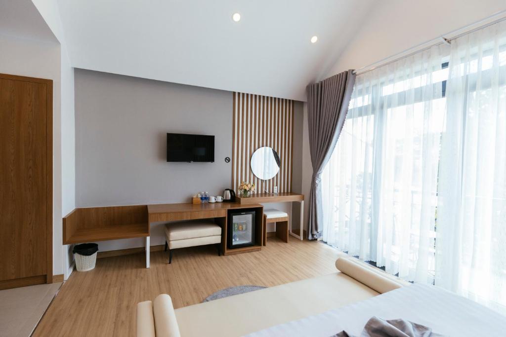 TV a/nebo společenská místnost v ubytování Minh Chi Hotel