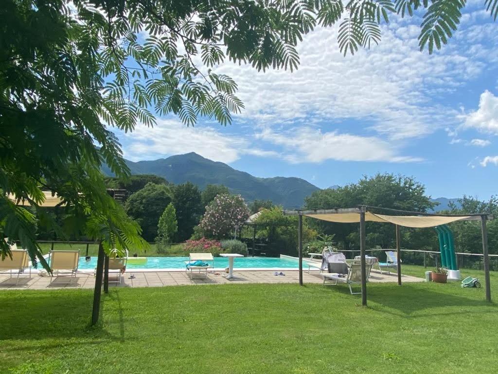 a pool with a view of the mountains at Agriturismo Chioi in Barga