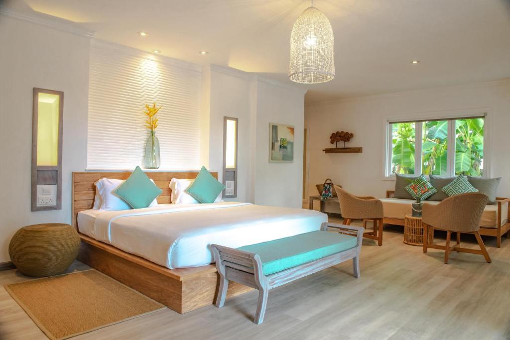 Uma cama ou camas num quarto em Hotel L'Archipel