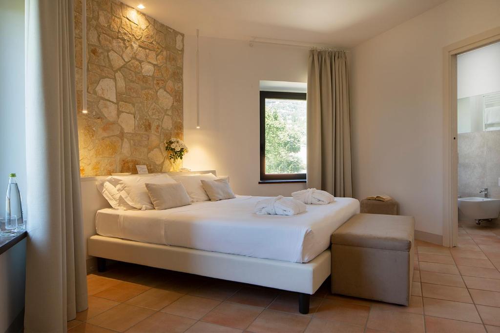 Posteľ alebo postele v izbe v ubytovaní Giotto Country House & Spa
