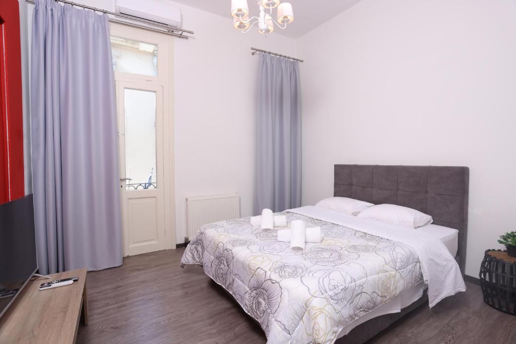 Ένα ή περισσότερα κρεβάτια σε δωμάτιο στο OPL Executive Apartment