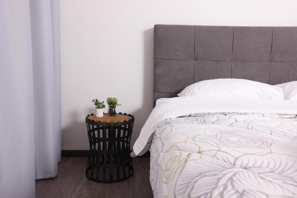 Posteľ alebo postele v izbe v ubytovaní OPL Executive Apartment