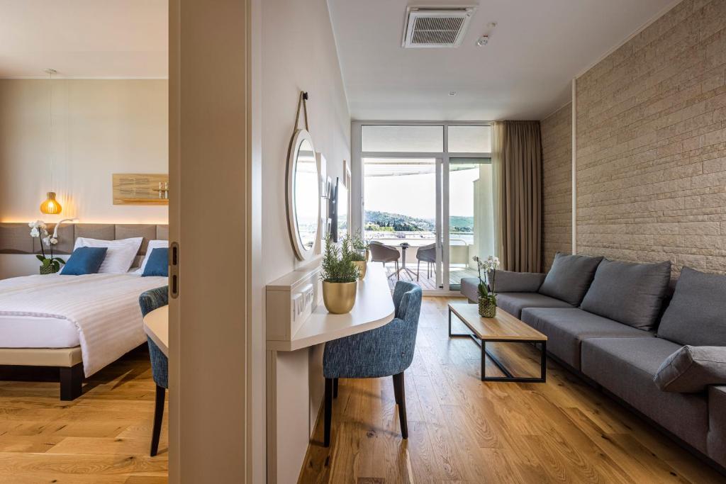 Postel nebo postele na pokoji v ubytování Hotel Histrion