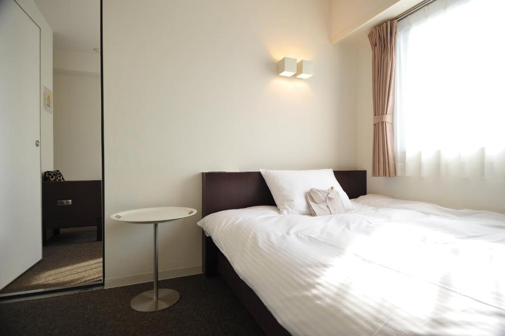 Postel nebo postele na pokoji v ubytování 7 Days Hotel Plus