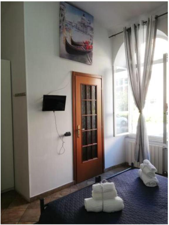 Postel nebo postele na pokoji v ubytování Rainbow Cinqueterre