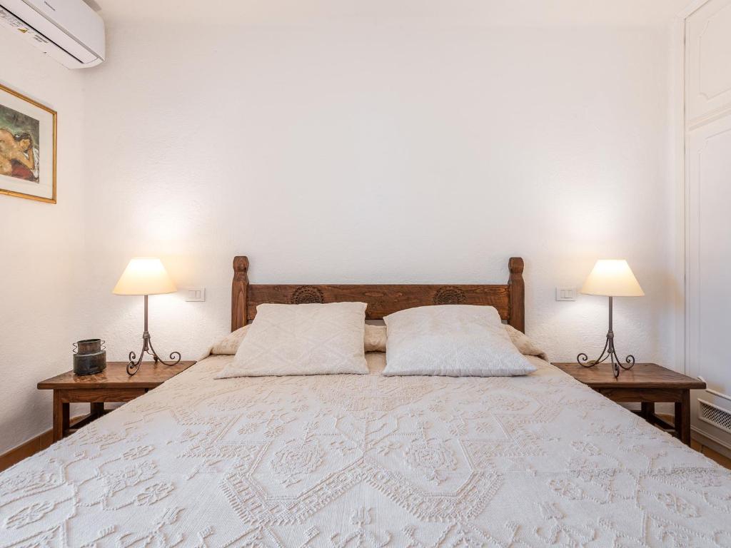 Postel nebo postele na pokoji v ubytování Relais Baia di Nelson