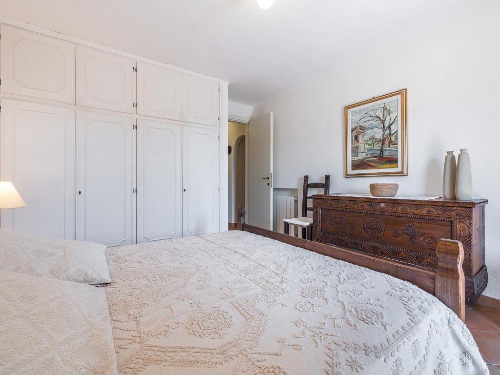 Postel nebo postele na pokoji v ubytování Relais Baia di Nelson