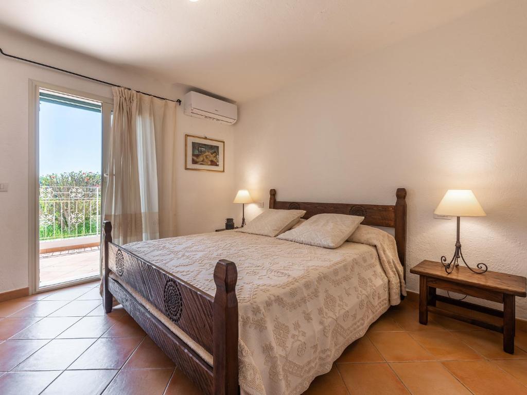 Postel nebo postele na pokoji v ubytování Relais Baia di Nelson