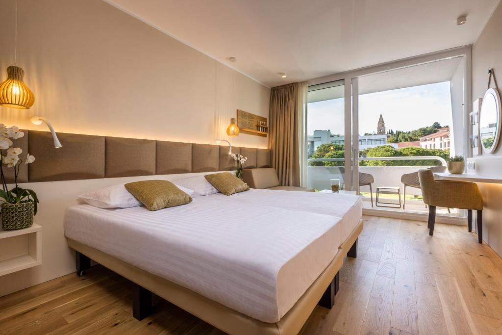 Postel nebo postele na pokoji v ubytování Hotel Histrion