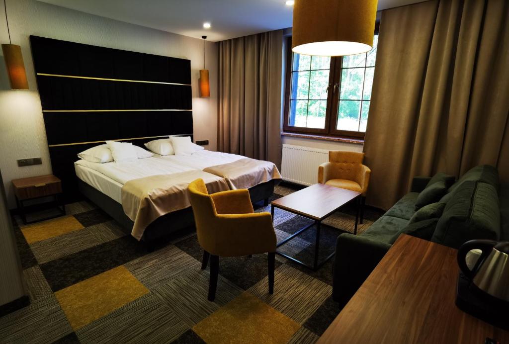 Posteľ alebo postele v izbe v ubytovaní Hotel Kormoran Resort & SPA