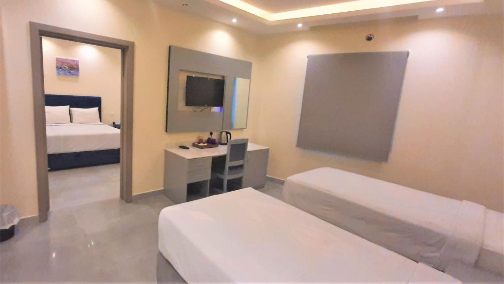 Postel nebo postele na pokoji v ubytování NASEEM HOTEL