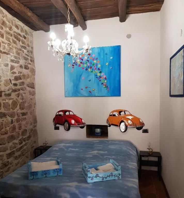 Posteľ alebo postele v izbe v ubytovaní Non ditelo al Duca - La Cappuccina