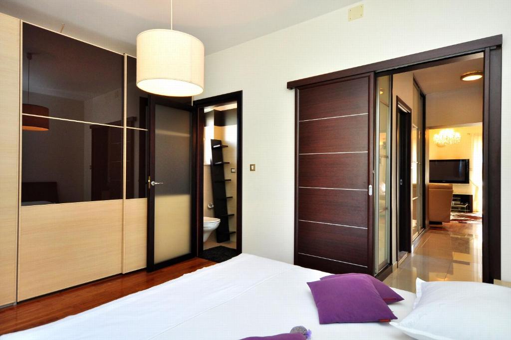 Posteľ alebo postele v izbe v ubytovaní Apartment SAKAL