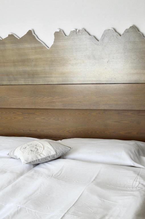 Postel nebo postele na pokoji v ubytování Hotel Scoiattolo