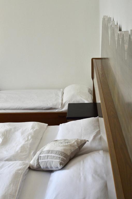 Postel nebo postele na pokoji v ubytování Hotel Scoiattolo