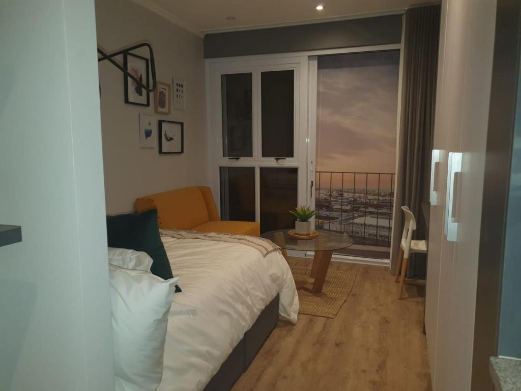 Ένα ή περισσότερα κρεβάτια σε δωμάτιο στο Executive Condo Studio Apartments