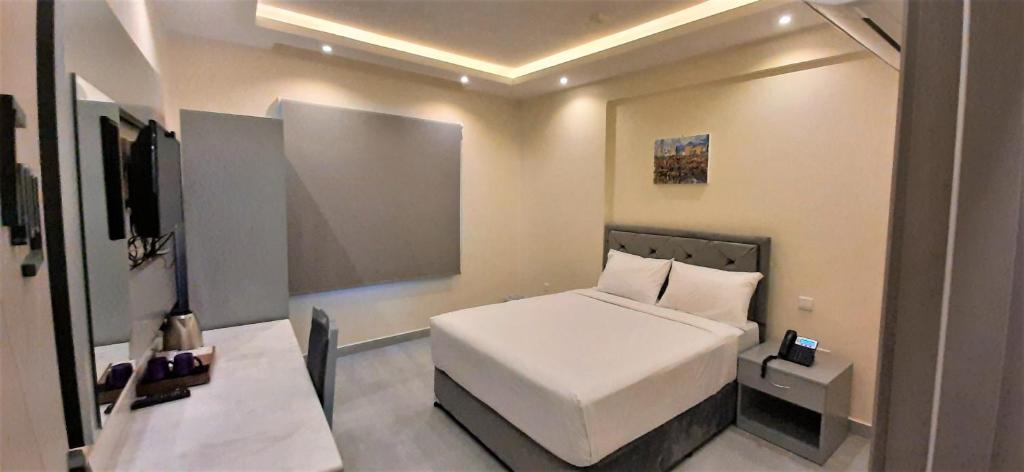 Postel nebo postele na pokoji v ubytování NASEEM HOTEL