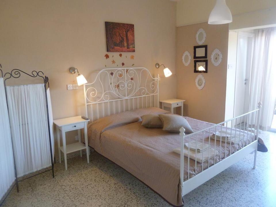 Ένα ή περισσότερα κρεβάτια σε δωμάτιο στο Capuralli Hotel