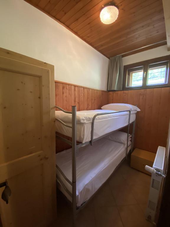 Postel nebo postele na pokoji v ubytování Appartamenti Sorapiss