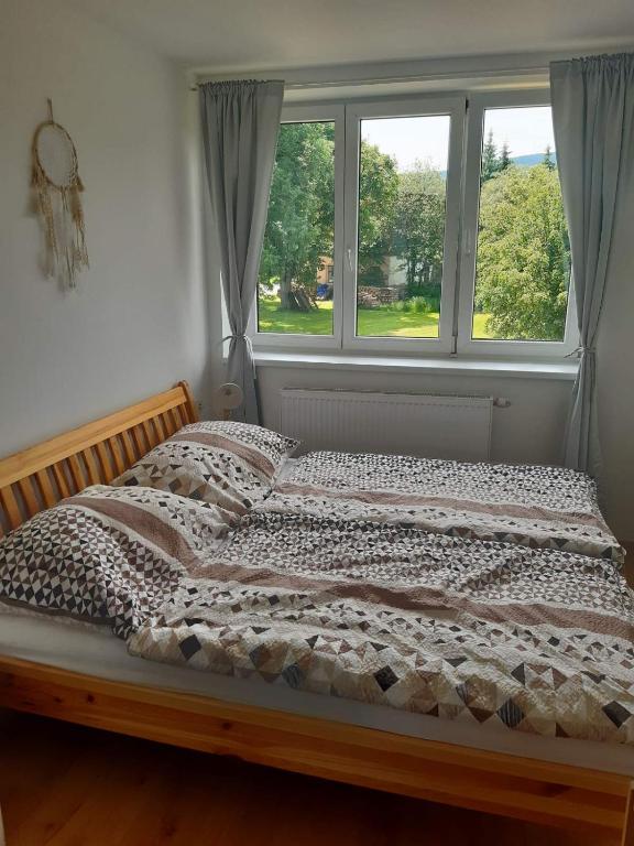 Postel nebo postele na pokoji v ubytování Apartmán u Kunštátského mlýna