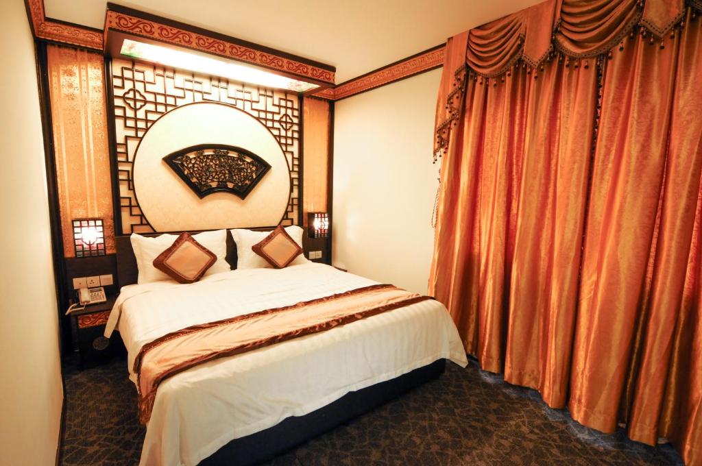 Postel nebo postele na pokoji v ubytování K Garden Hotel Parit Buntar
