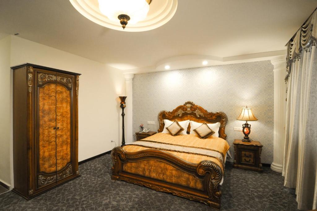 Postel nebo postele na pokoji v ubytování K Garden Hotel Parit Buntar