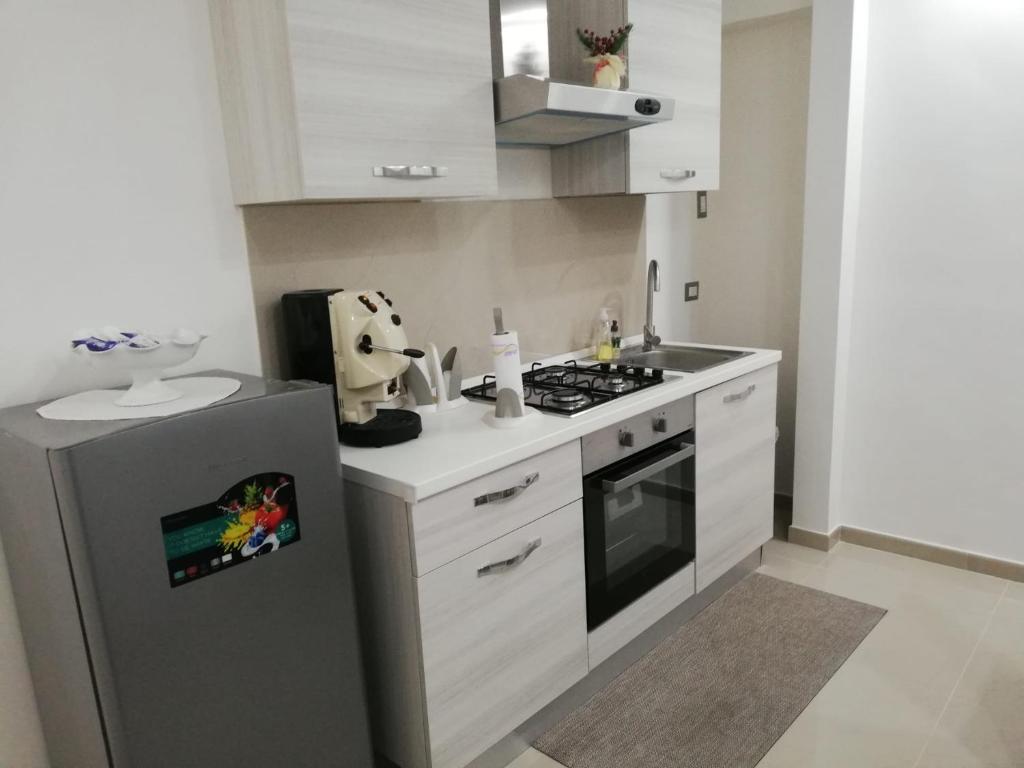 A kitchen or kitchenette at B&B Oplonti Resort