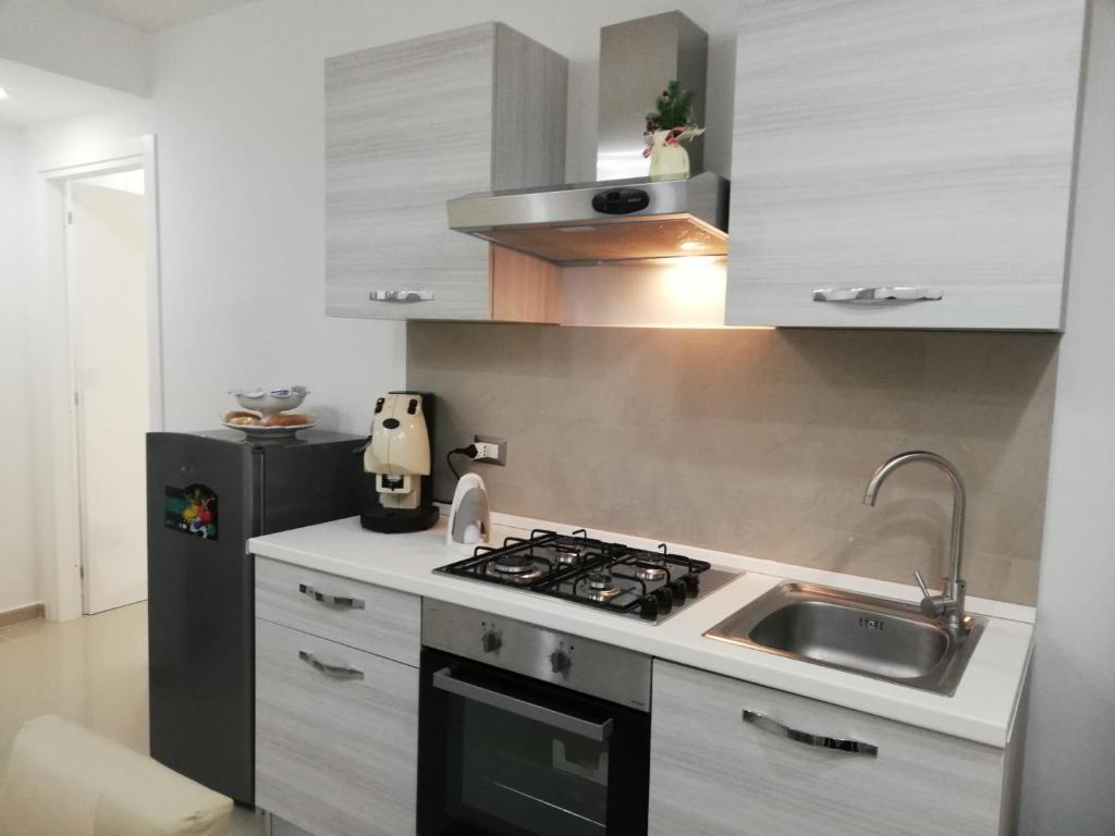 A kitchen or kitchenette at B&B Oplonti Resort