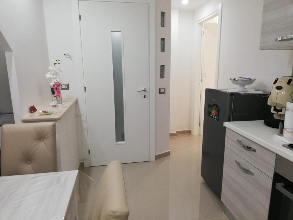 A kitchen or kitchenette at B&B Oplonti Resort