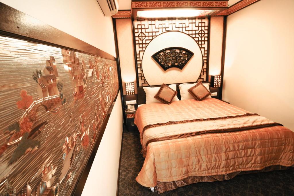 Postel nebo postele na pokoji v ubytování K Garden Hotel Parit Buntar