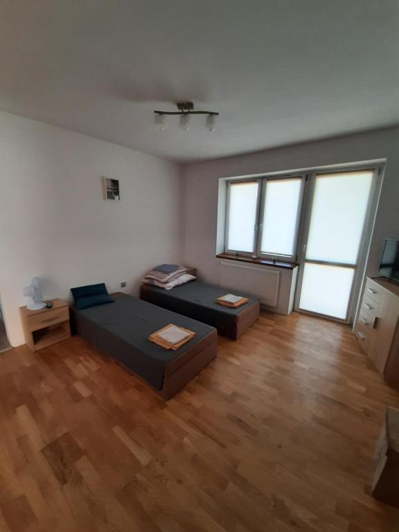 Posteľ alebo postele v izbe v ubytovaní Raczkowska Apartament