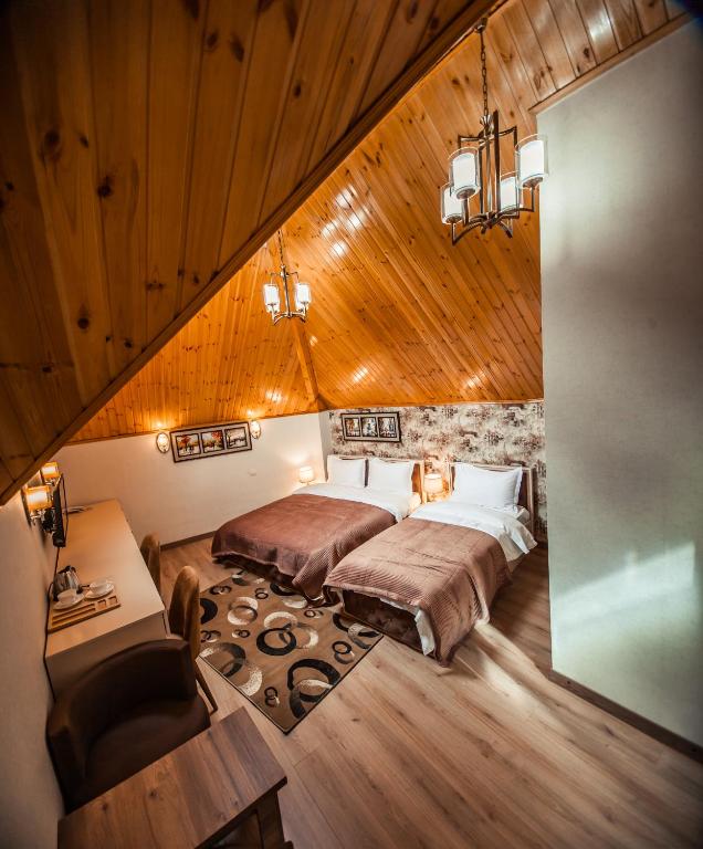Postel nebo postele na pokoji v ubytování MUSMORE Boutique Hotel