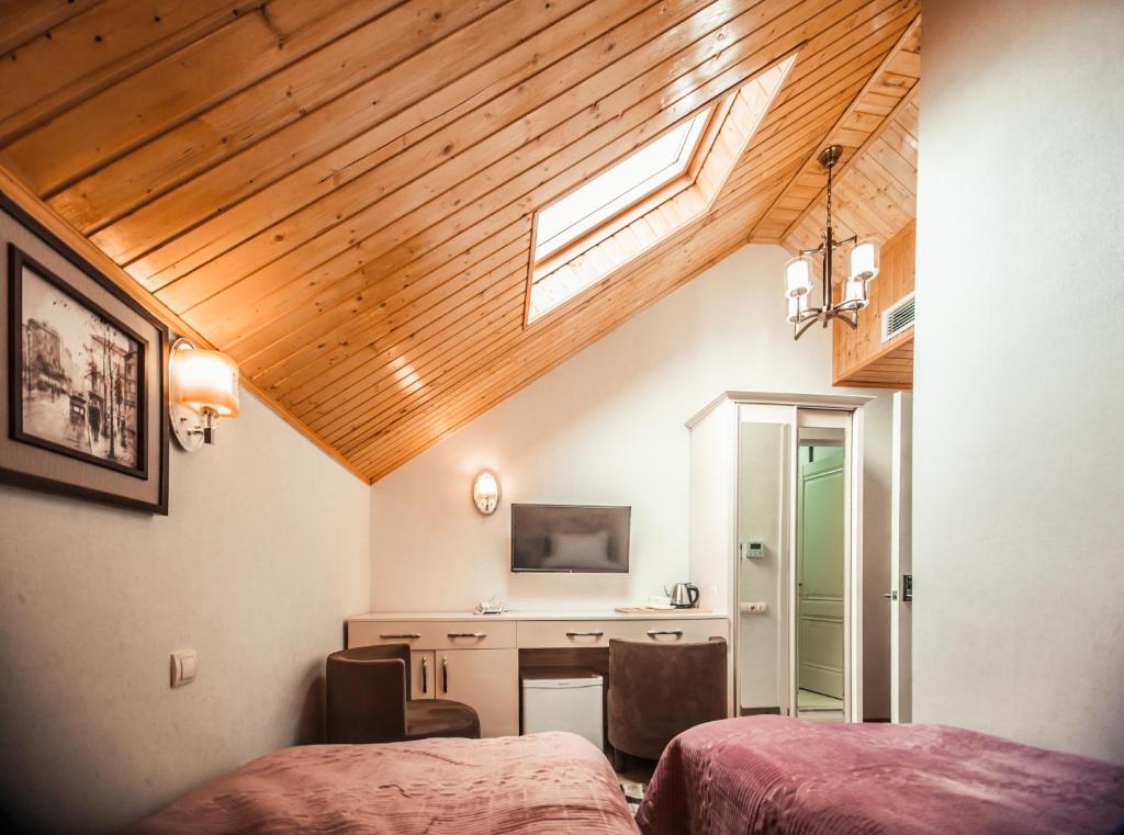 TV a/nebo společenská místnost v ubytování MUSMORE Boutique Hotel