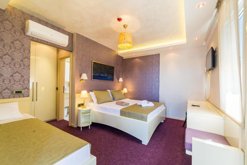Postel nebo postele na pokoji v ubytování Villa Katarina